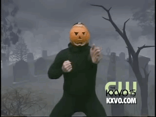A man dressed as a pumpkin dancing